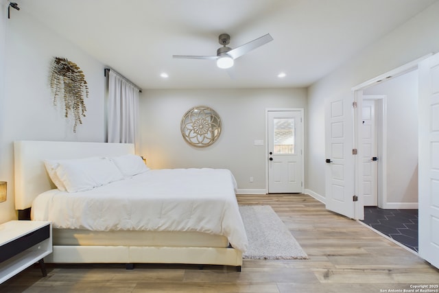 bedroom featuring hardwood / wood-style flooring and ceiling fan