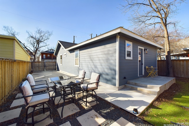 back of property with a patio