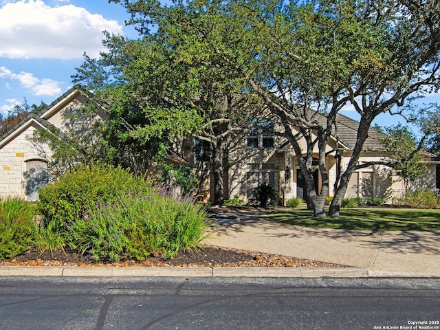 view of property hidden behind natural elements