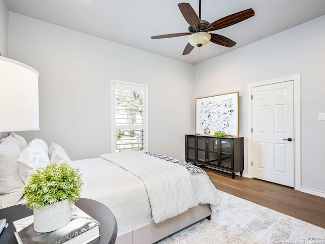 bedroom featuring hardwood / wood-style floors and ceiling fan