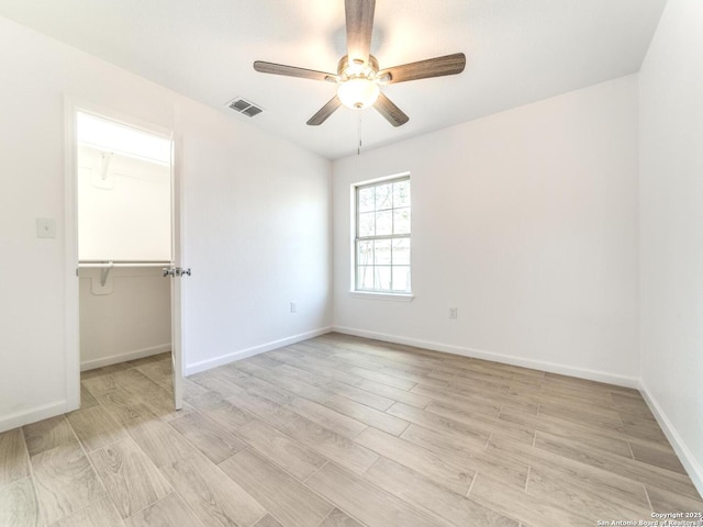 unfurnished room featuring ceiling fan and light hardwood / wood-style flooring