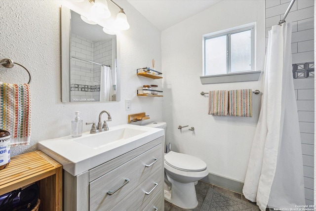 bathroom with tile patterned floors, vanity, toilet, and a shower with shower curtain