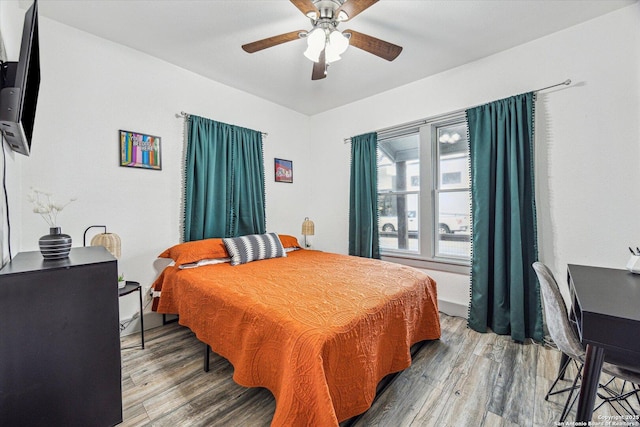 bedroom featuring ceiling fan and hardwood / wood-style floors