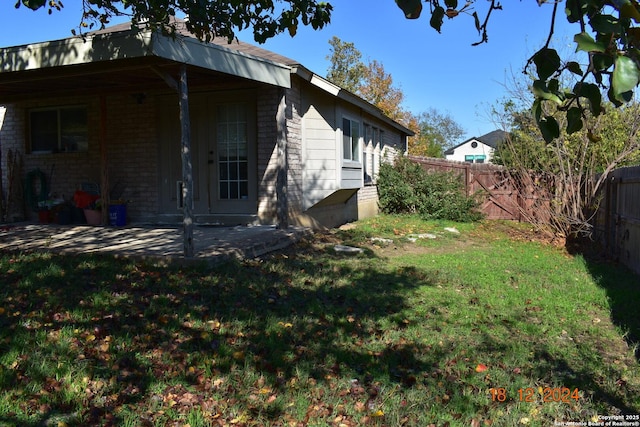 exterior space with a yard and a patio area