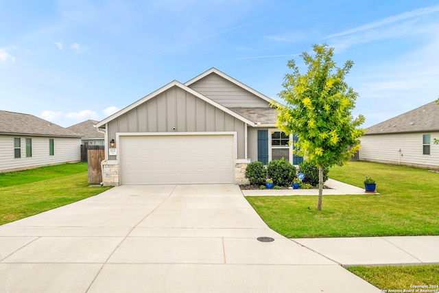 view of front of home with a garage and a front yard