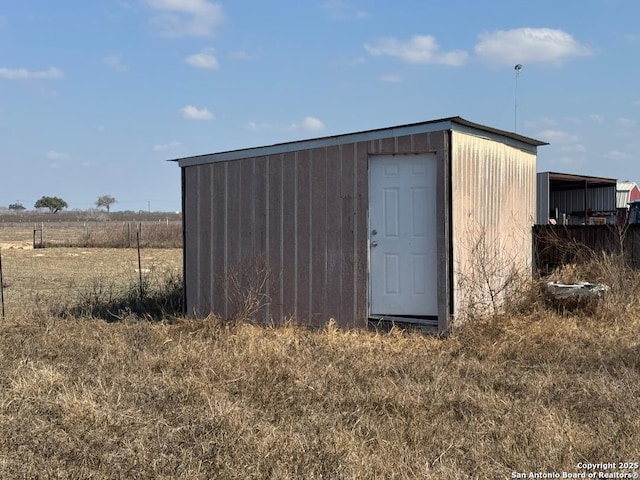 view of outbuilding featuring a rural view