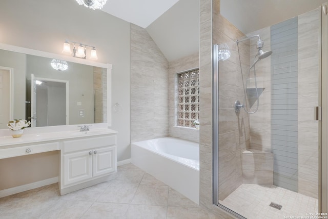 bathroom featuring tile patterned flooring, plus walk in shower, vaulted ceiling, and vanity