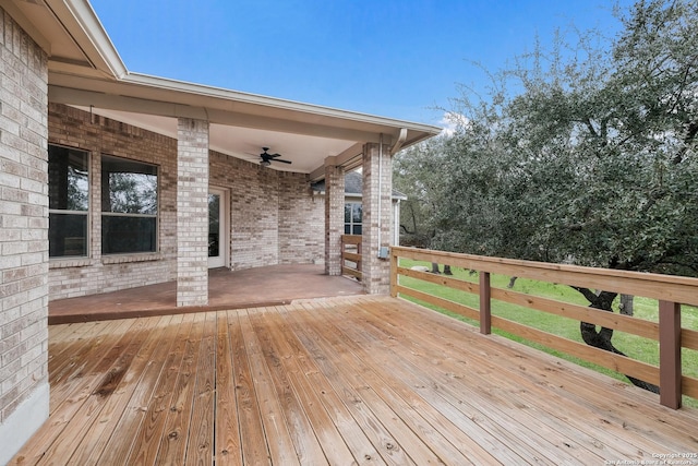 wooden deck featuring ceiling fan