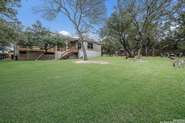 view of yard featuring a wooden deck