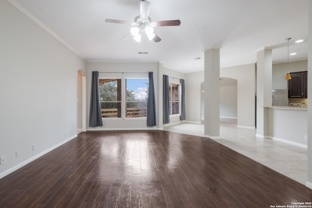 unfurnished living room featuring ornamental molding, hardwood / wood-style floors, and ceiling fan