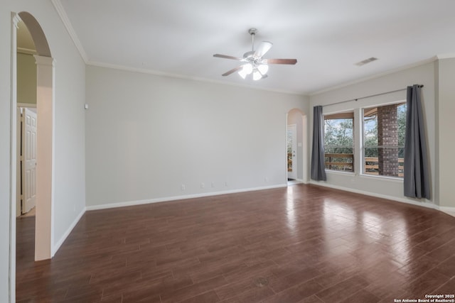 spare room featuring ornamental molding, dark hardwood / wood-style floors, and ceiling fan