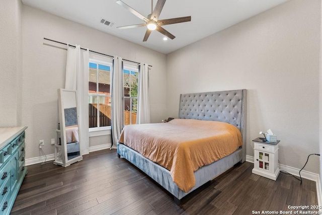 bedroom with dark wood-type flooring and ceiling fan