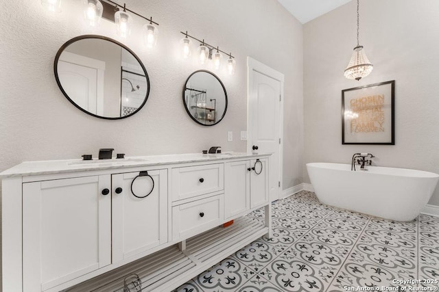 bathroom featuring vanity, tile patterned flooring, and a tub