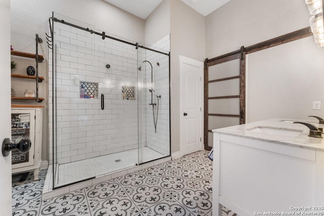 bathroom featuring vanity, tile patterned floors, and walk in shower