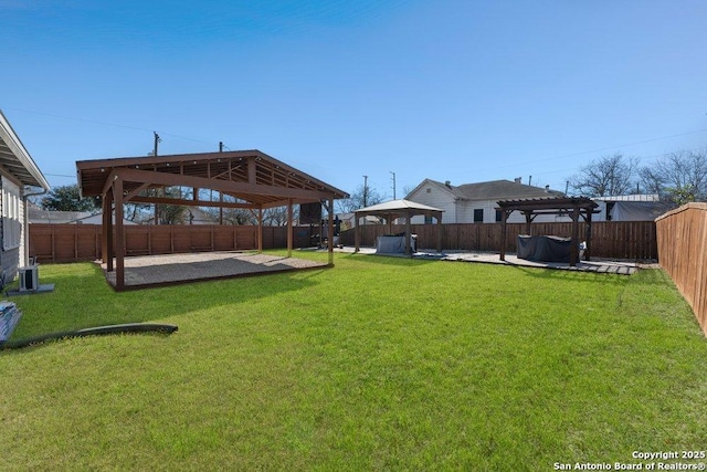 view of yard with a gazebo and central AC