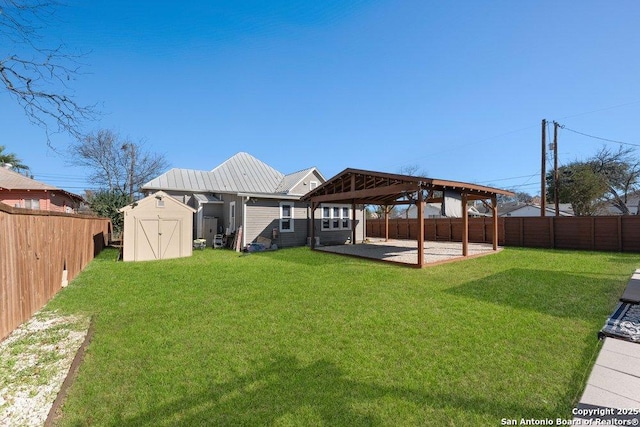 rear view of house with a gazebo, a yard, a shed, and a patio