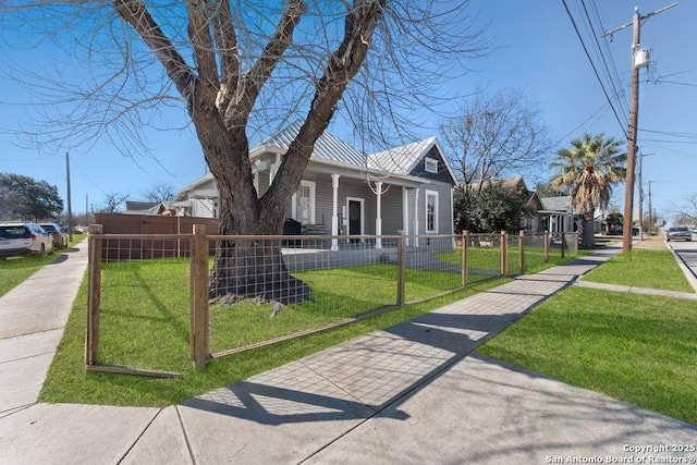 bungalow-style house with a front lawn