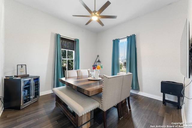 dining area with dark hardwood / wood-style floors and ceiling fan