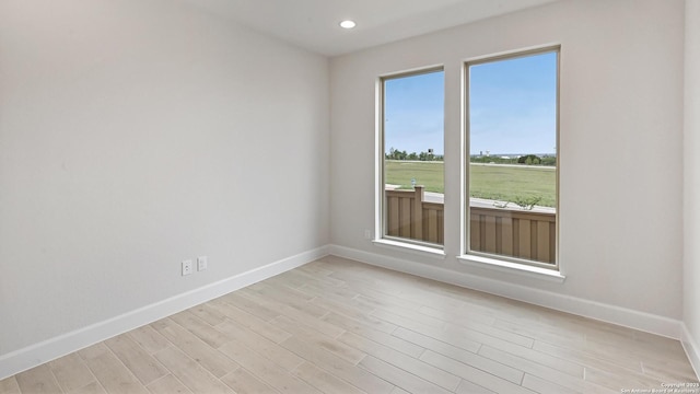 305 Hulda Trl, New Braunfels, TX 78130 - empty room featuring baseboards, light wood finished floors, and recessed lighting