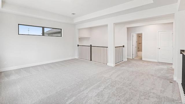 305 Hulda Trl, New Braunfels, TX 78130 - empty room with light carpet, a raised ceiling, and baseboards