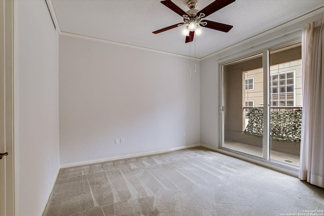 unfurnished room featuring ceiling fan, ornamental molding, light carpet, and a textured ceiling