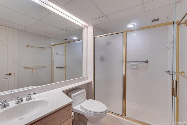 bathroom with vanity, an enclosed shower, and toilet