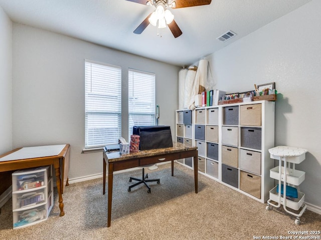 office area with carpet floors and ceiling fan