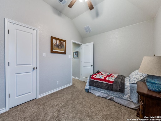 bedroom with vaulted ceiling, ceiling fan, and carpet flooring