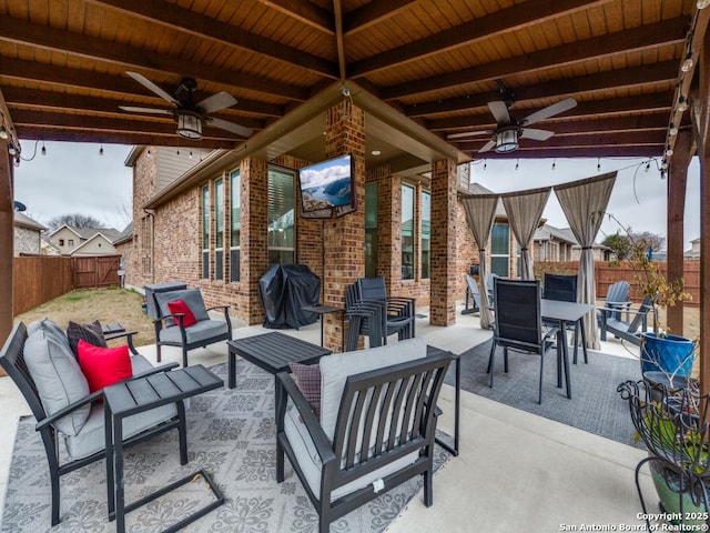 view of patio with ceiling fan, grilling area, and outdoor lounge area