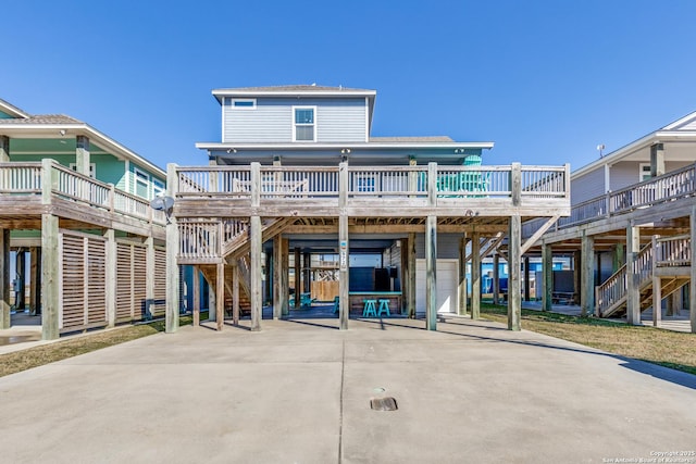 back of property with a carport