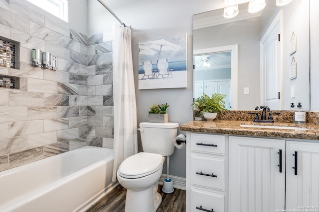 full bathroom with toilet, vanity, shower / bathtub combination with curtain, ceiling fan, and hardwood / wood-style floors