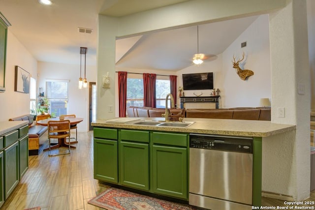 kitchen with pendant lighting, stainless steel dishwasher, and green cabinetry