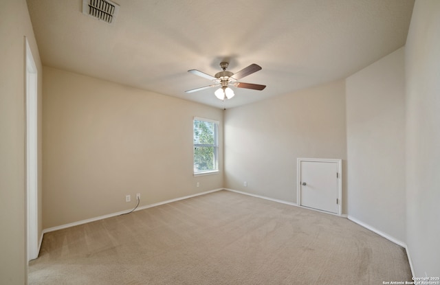 unfurnished room featuring light carpet and ceiling fan