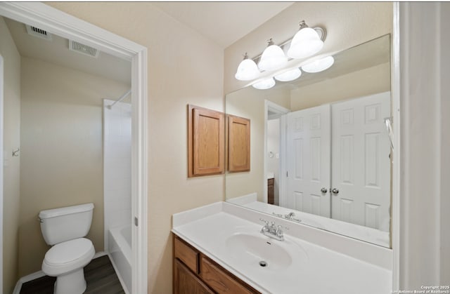 full bathroom with vanity,  shower combination, and toilet