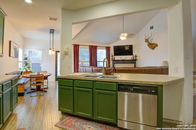 kitchen with hanging light fixtures, dishwasher, and green cabinets