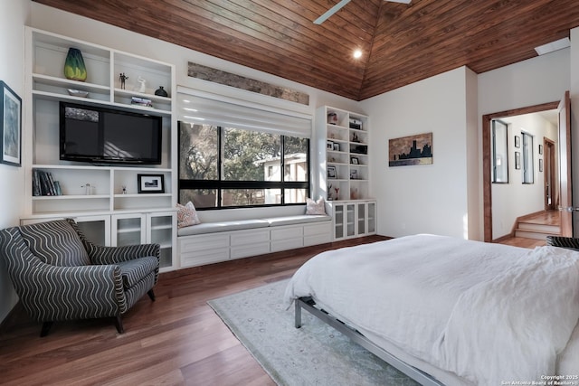 bedroom featuring wood-type flooring, vaulted ceiling, and wooden ceiling