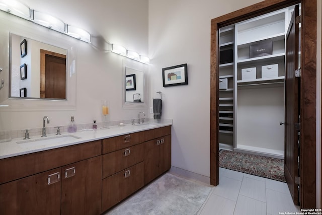 bathroom with vanity and tile patterned flooring