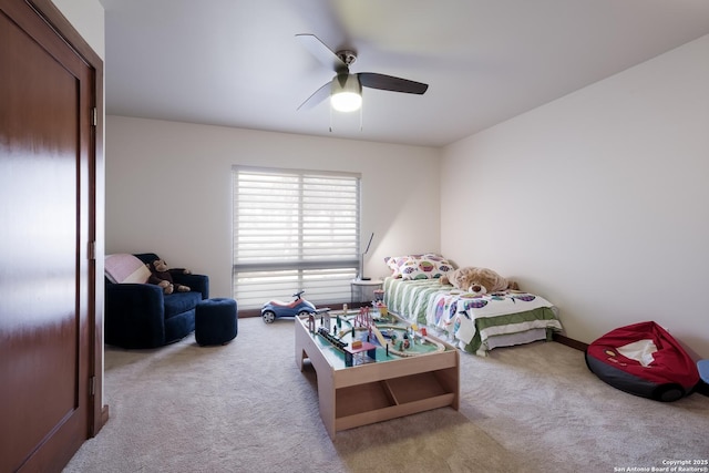 carpeted bedroom featuring ceiling fan