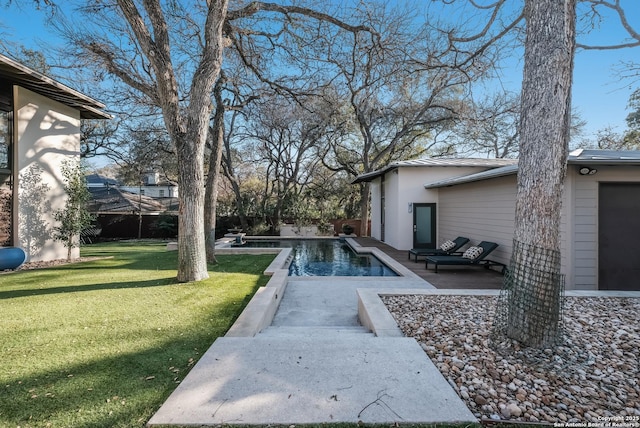 view of pool featuring a patio area and a lawn