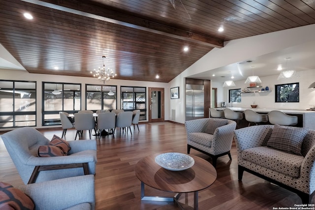 living room with hardwood / wood-style flooring, wood ceiling, an inviting chandelier, and vaulted ceiling with beams