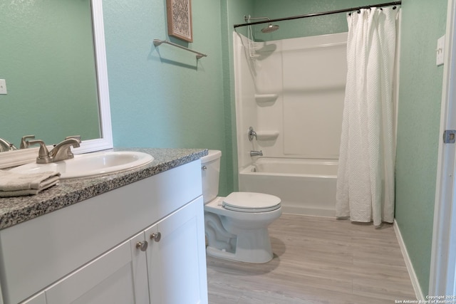 full bathroom featuring toilet, wood-type flooring, shower / bathtub combination with curtain, and vanity