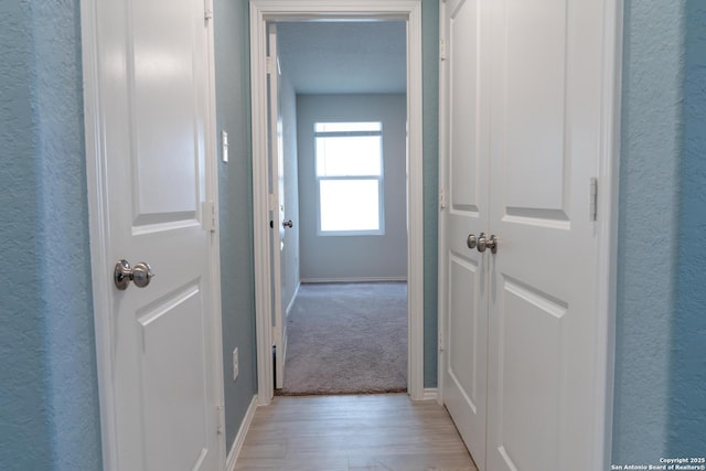 hallway featuring light hardwood / wood-style floors