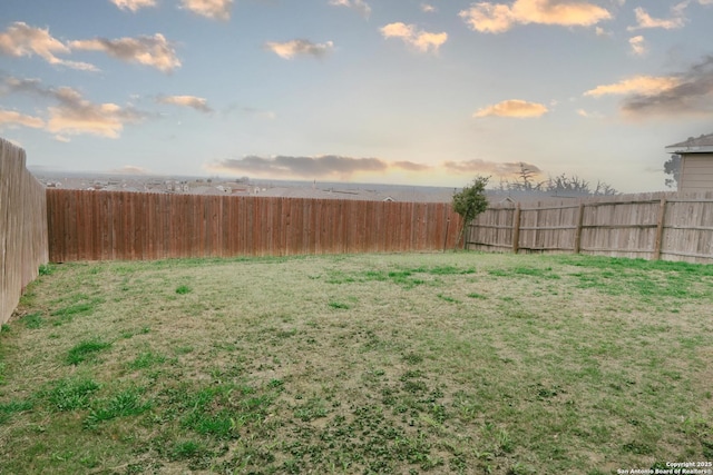 view of yard at dusk