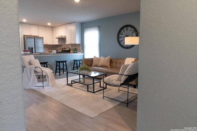 living room with light hardwood / wood-style flooring