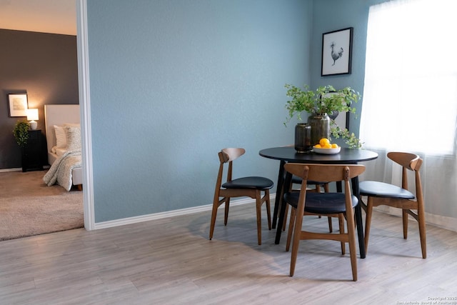 dining area with light hardwood / wood-style floors