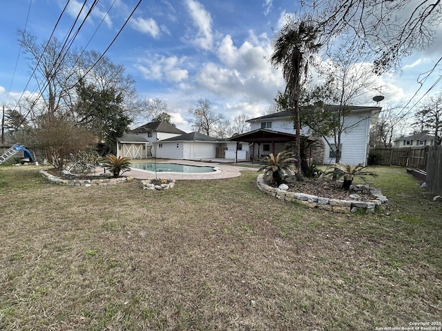 view of yard with a fenced in pool