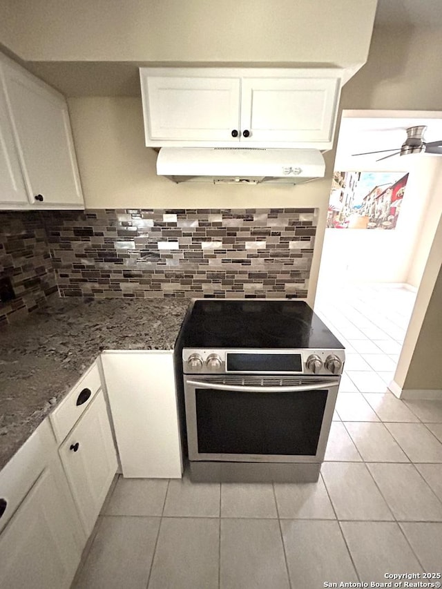 kitchen featuring white cabinets, stainless steel range with electric cooktop, and ceiling fan