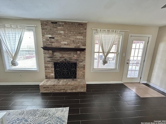 unfurnished living room featuring a fireplace