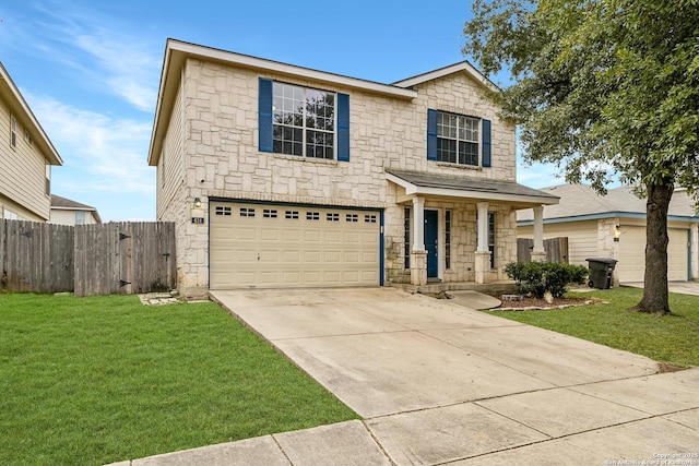 view of front of home with a garage and a front yard