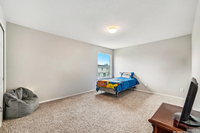 carpeted bedroom with a textured ceiling